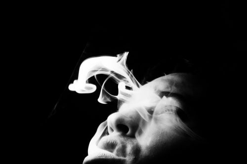 man black and white smoke