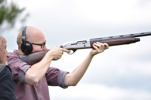 man shooting rifle