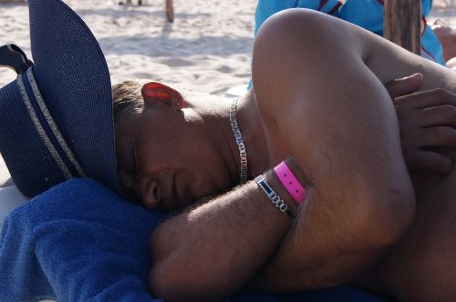 man sleep beach