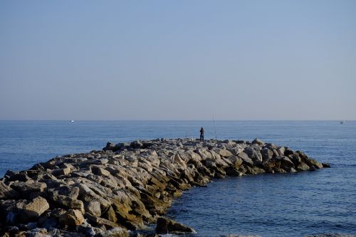 man fishing sea