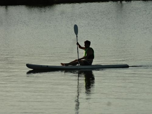 man kayak lake