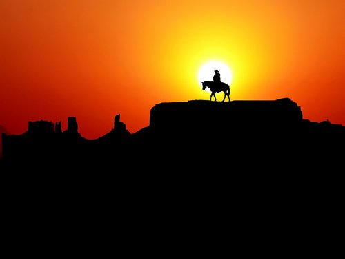 man  horse  sunset