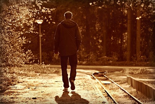 man  walking  railway
