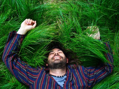 man grass happy