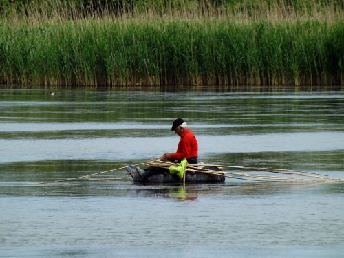 man boat lake