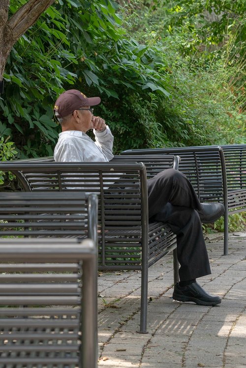 man sitting on bench  thinking  man