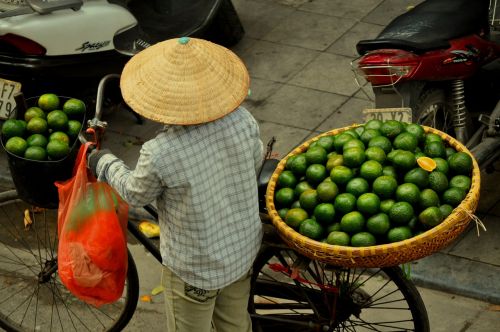 market woman hanoi oranges