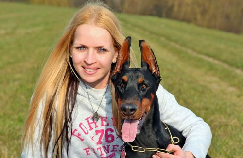 blonde woman doberman