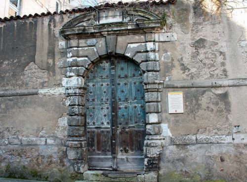 medieval street door studded door green wooden door