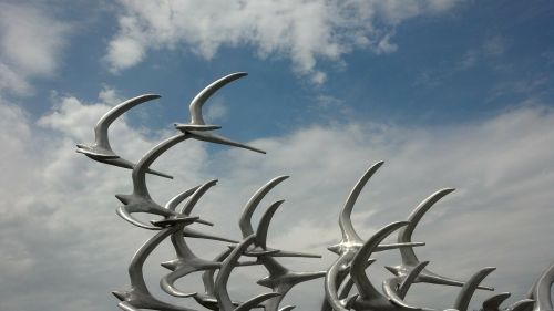 memorial birds in flight sculpture