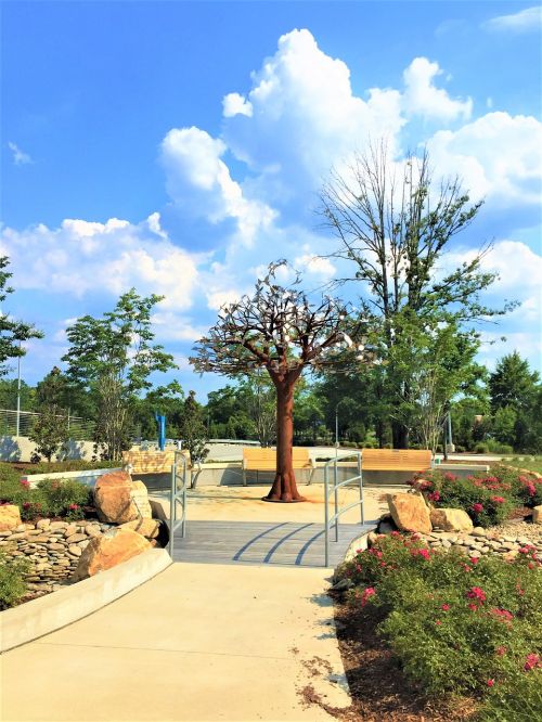 metal tree sculpture blue sky