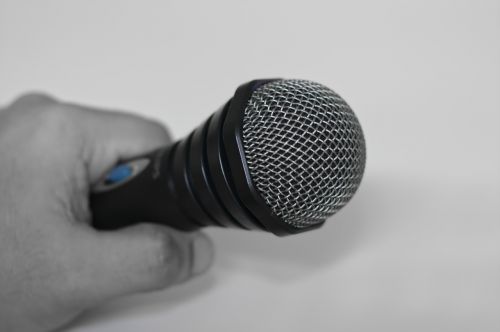 microphone hand holding microphone speaker