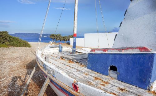 milos old fishing boat blue sky