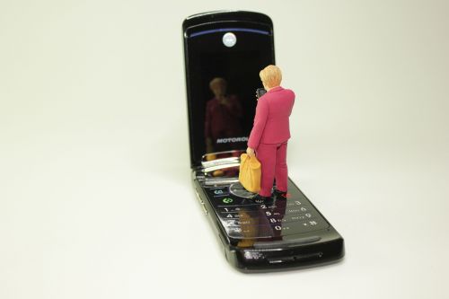 miniature figures cellphone mirror image