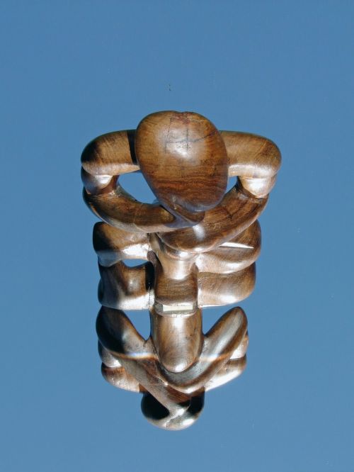 mirroring wood figure