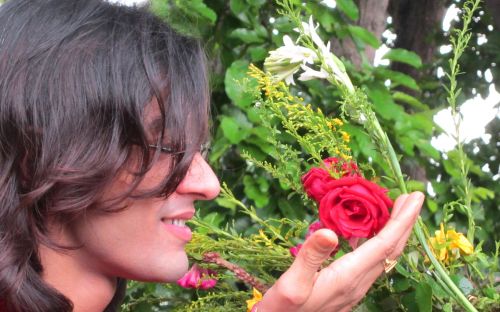 Model Touching Red Rose