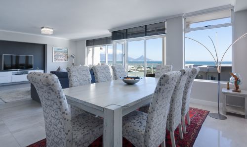 modern minimalist dining room open plan sea view