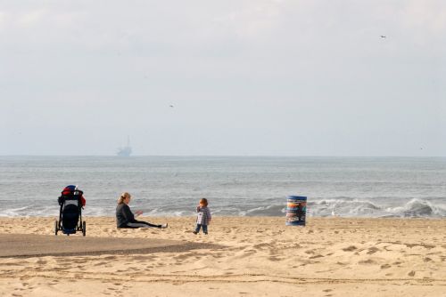 Mom And Child On The Beach