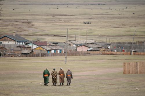 mongolian men hiking mongolian views