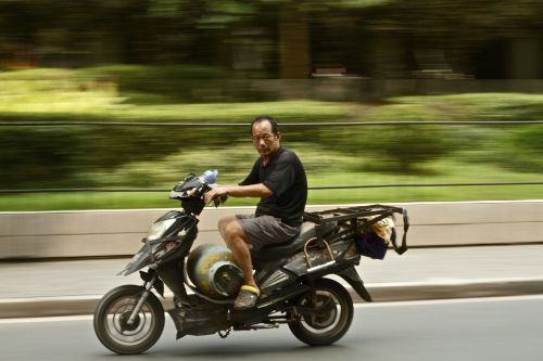 moped riding scooter