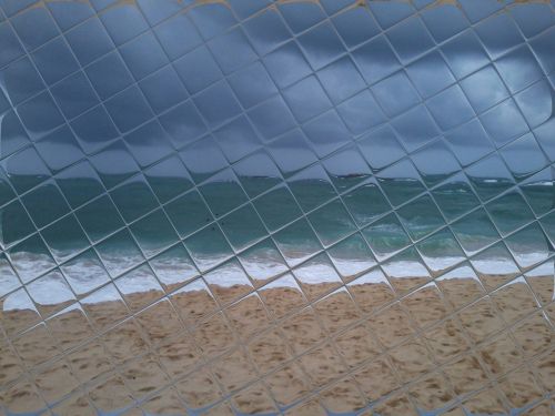 mosaic sea glassed sea beach through checked glass