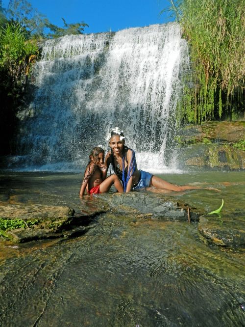 mother and daughter waterfall nature