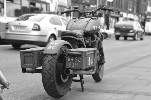 motorcycle cars sidewalk