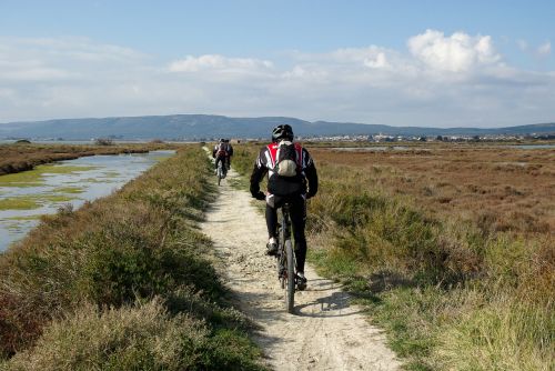 mountain biking cyclists hiking