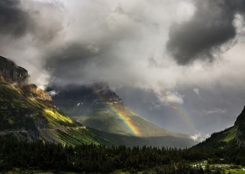 mountain range valley rainbow