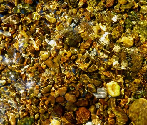 mountain stream crystal clear colorful stone