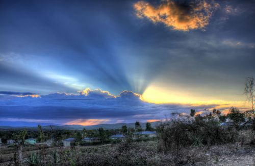 Mountain Sunset Behind Clouds