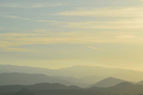 mountains fog sunset