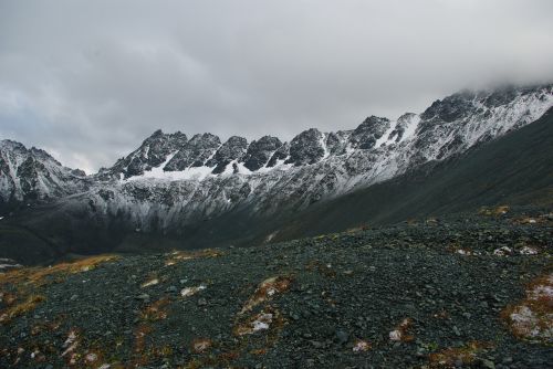 mountains partly cloudy snow