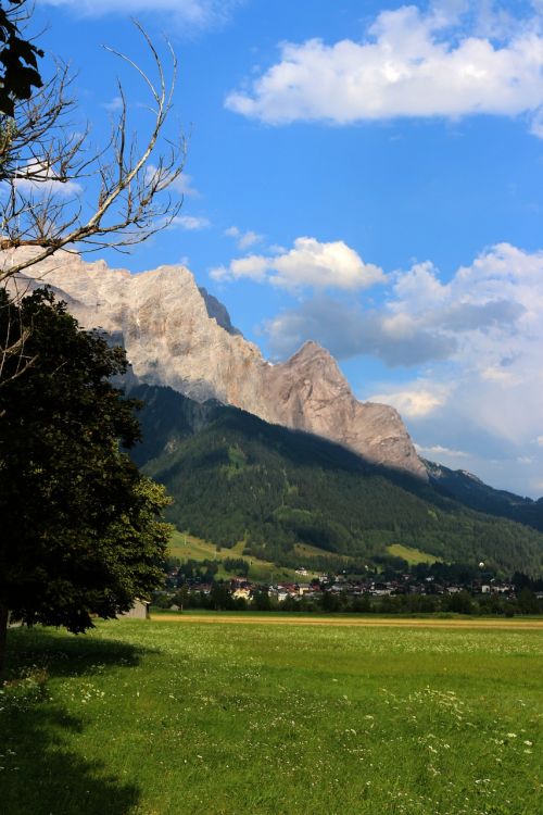 mountains meadow clouds