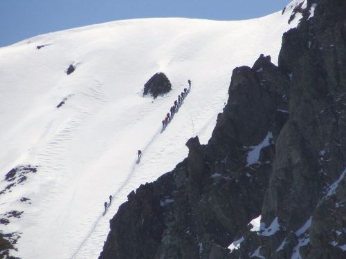 mountains climbing skiers