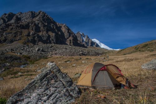 mountains rocks tent