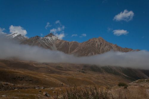 mountains snow clouds