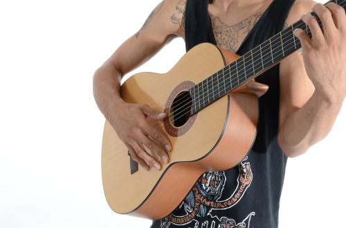 boy tattoos guitar