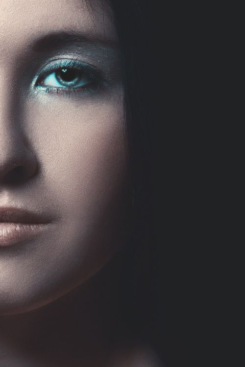 mystical portrait of a girl eyes black background