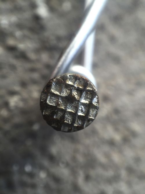 nail metal macro
