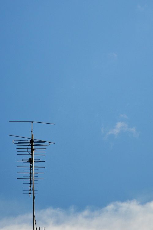negative space antena blue sky