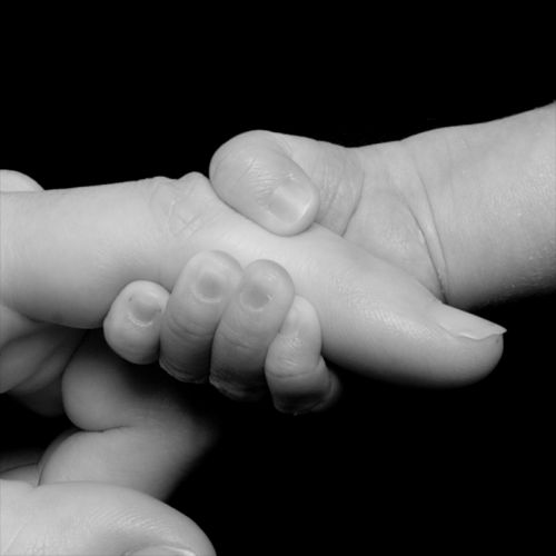 newborn hands holding
