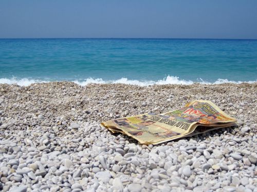 Newspaper On Beach