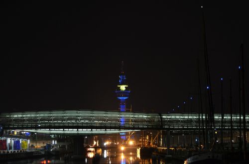 night photograph radar tower glass bridge