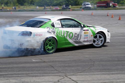 nissan silvia drift competition smoke from under the wheels