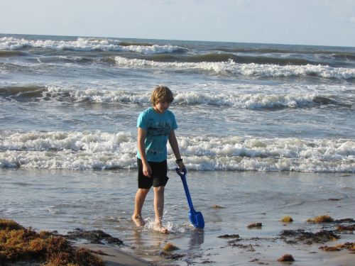 ocean coast line boy on beach