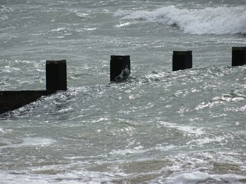 Ocean Sea Waves Against The Groynes