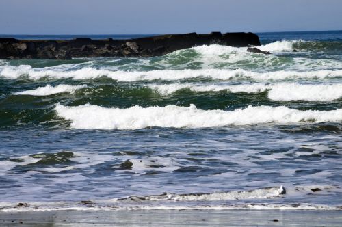 Ocean Waves Around The Jetty