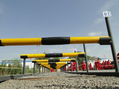 oil workers railing pipeline