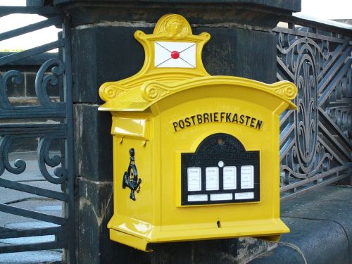 old yellow post mail box